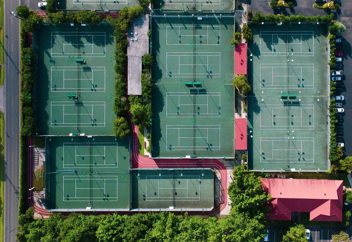 Aerial view of a tennis club with several outdoor courts